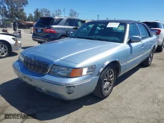 1999 Mercury Grand Marquis LS with VIN 2MEFM75WXXX629568, listed as a IAAI auction lot 41937347 with 166,100 mi miles. Bid and sale history available at carsss.com. Image 2.