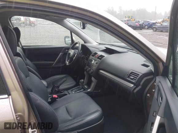 2015 Subaru Forester Touring with VIN JF2SJAUC1FH457069, listed as a IAAI auction lot 42293542 with 71,689 mi miles and . Bid and sale history available at DreamBid. Image 5.
