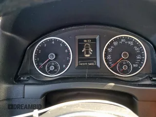 2014 Volkswagen Tiguan SEL z VIN WVGAV3AX6EW030705, wystawiony jako Copart lot #52156805 z przebiegiem 142 377 mil mil oraz Szkoda całkowita • Salvage title. Historia ofert i sprzedaży dostępna na DreamBid. Obrazek 9.