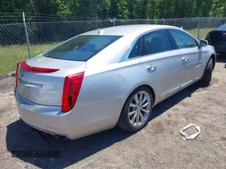 2014 Cadillac XTS Luxury z VIN 2G61M5S31E9199170, wystawiony jako IAAI lot #42150000 z przebiegiem 135 414 mil mil oraz . Historia ofert i sprzedaży dostępna na DreamBid. Obrazek 4.
