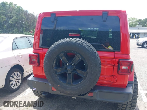 2021 Jeep Wrangler Unlimited Sahara z VIN 1C4HJXEGXMW631033, wystawiony jako IAAI lot #42550070 z przebiegiem 54 429 mil mil oraz . Historia ofert i sprzedaży dostępna na DreamBid. Obrazek 16.
