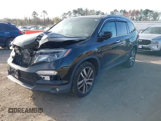 2017 Honda Pilot Touring with VIN 5FNYF6H9XHB062171, listed as a IAAI auction lot 41927969 with 210,633 mi miles. Bid and sale history available at carsss.com. Image 17.