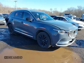 2021 Mazda CX-9 Grand Touring with VIN JM3TCBDY5M0506632, listed as a IAAI auction lot 41589264 with 50,026 mi miles and . Bid and sale history available at carsss.com. Image 1.