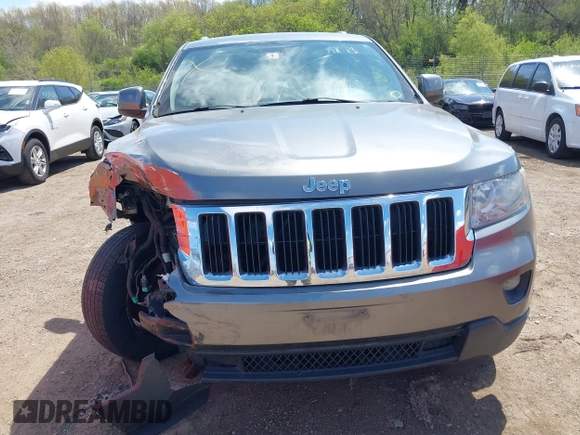 2011 Jeep Grand Cherokee Laredo with VIN 1J4RR4GGXBC587911, listed as a IAAI auction lot 42156885 with 178,999 mi miles and . Bid and sale history available at DreamBid. Image 12.