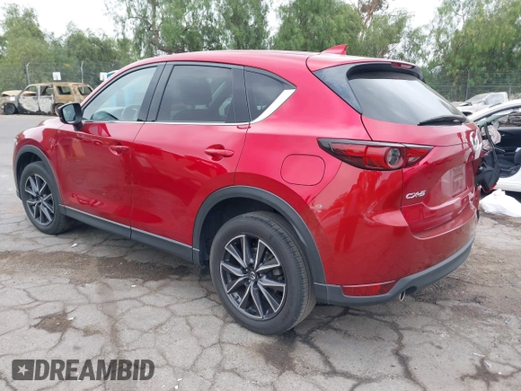 2018 Mazda CX-5 Grand Touring with VIN JM3KFADMXJ0302656, listed as a IAAI auction lot 42099173 with 125,378 mi miles and . Bid and sale history available at DreamBid. Image 3.