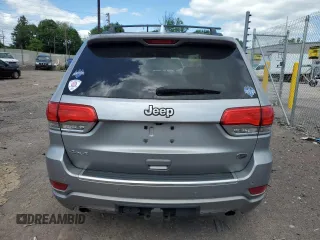2015 Jeep Grand Cherokee Overland with VIN 1C4RJFCG3FC880084, listed as a Copart auction lot 57291165 with 112,442 mi miles and Salvage title. Bid and sale history available at DreamBid. Image 6.