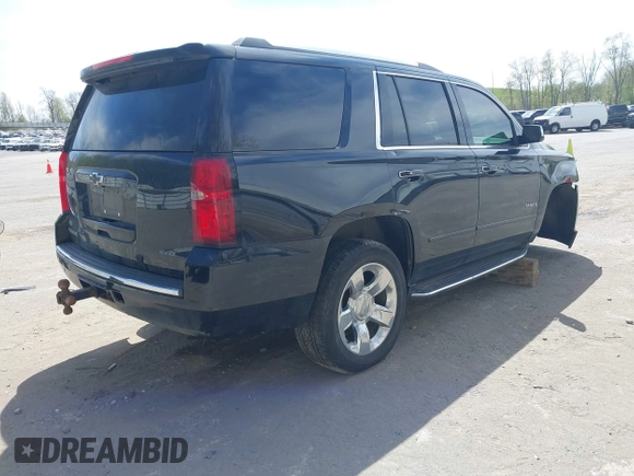 2015 Chevrolet Tahoe LTZ with VIN 1GNSKCKC8FR514671, listed as a IAAI auction lot 42157084 with 182,665 mi miles and . Bid and sale history available at DreamBid. Image 4.