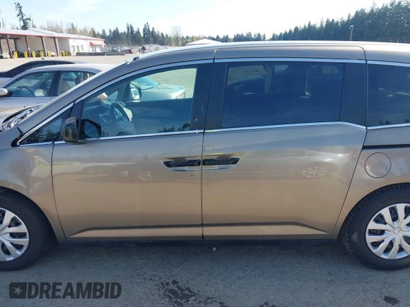 2013 Honda Odyssey LX z VIN 5FNRL5H29DB055166, wystawiony jako IAAI lot #41965037 z przebiegiem 122 470 mil mil oraz . Historia ofert i sprzedaży dostępna na DreamBid. Obrazek 14.