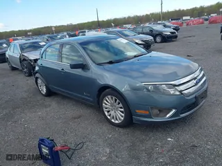2011 Ford Fusion Hybrid with VIN 3FADP0L39BR264412, listed as a IAAI auction lot 42038511 with 134,166 mi miles. Bid and sale history available at carsss.com. Image 1.