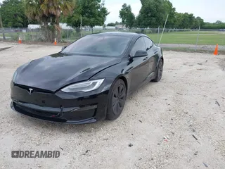2022 Tesla Model S with VIN 5YJSA1E51NF472152, listed as a IAAI auction lot 42625943 with 60,290 mi miles and . Bid and sale history available at DreamBid. Image 18.