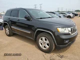 2011 Jeep Grand Cherokee Laredo with VIN 1J4RR4GGXBC567450, listed as a Copart auction lot 60056085 with 165,077 mi miles and Salvage title. Bid and sale history available at DreamBid. Image 4.