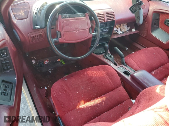 1993 Chrysler LeBaron z VIN 1C3XU4534PF654847, wystawiony jako Copart lot #84391684 z przebiegiem 129 520 mil mil oraz Szkoda całkowita • Salvage title. Historia ofert i sprzedaży dostępna na DreamBid. Obrazek 8.