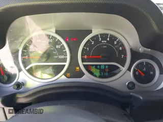 2010 Jeep Wrangler Sport with VIN 1J4AA2D11AL117404, listed as a IAAI auction lot 42012340 with 266,310 mi miles and . Bid and sale history available at carsss.com. Image 7.