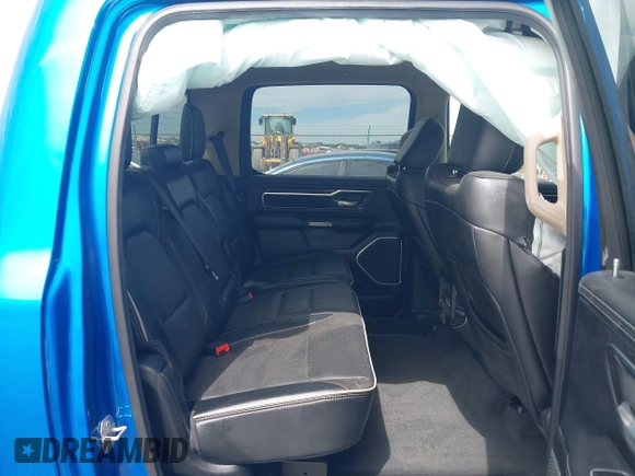 2021 Ram 1500 Laramie with VIN 1C6SRFJT1MN774879, listed as a IAAI auction lot 42242318 with 51,971 mi miles and . Bid and sale history available at DreamBid. Image 8.