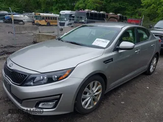 2014 Kia Optima EX z VIN 5XXGN4A70EG335090, wystawiony jako IAAI lot #42272655 z przebiegiem 165 795 mil mil oraz . Historia ofert i sprzedaży dostępna na DreamBid. Obrazek 2.
