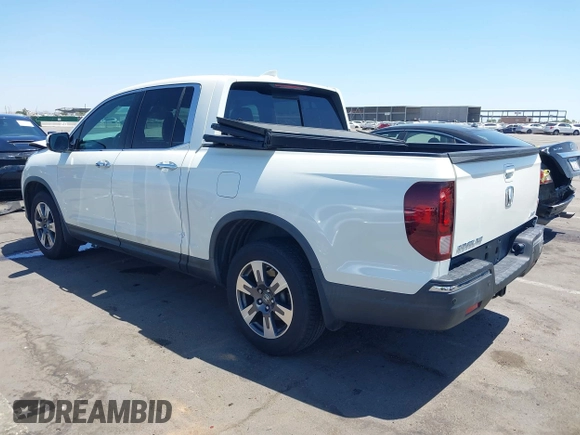 2019 Honda Ridgeline RTL-E with VIN 5FPYK3F74KB009279, listed as a IAAI auction lot 42348773 with 98,141 mi miles and . Bid and sale history available at DreamBid. Image 3.