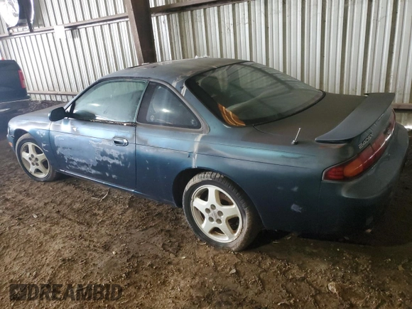 1995 Nissan 240SX z VIN JN1AS44D6SW020744, wystawiony jako Copart lot #64406924 z przebiegiem 87 165 mil mil oraz Szkody całkowita. Historia ofert i sprzedaży dostępna na DreamBid. Obrazek 2.