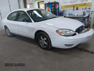 2007 Ford Taurus SE z VIN 1FAFP53UX7A113594, wystawiony jako IAAI lot #41959030 z przebiegiem 96 919 mil mil oraz . Historia ofert i sprzedaży dostępna na DreamBid. Obrazek 1.