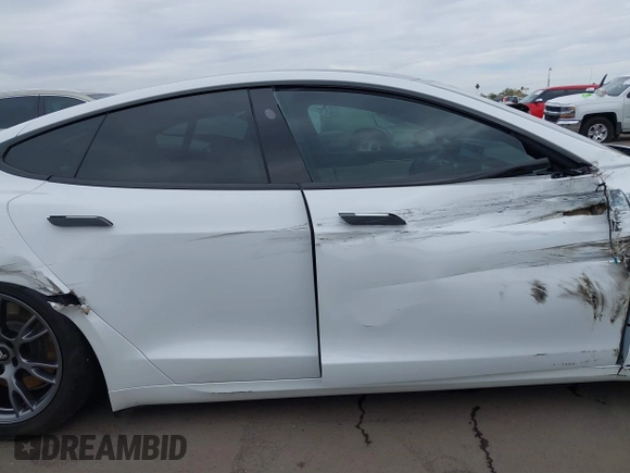2021 Tesla Model S Long Range with VIN 5YJSA1E57MF453815, listed as a IAAI auction lot 41818700 with 51,176 mi miles and . Bid and sale history available at DreamBid. Image 14.