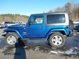 2009 Jeep Wrangler Sahara z VIN 1J4FA54199L722192, wystawiony jako IAAI lot #41619305 z przebiegiem 105 545 mil mil oraz . Historia ofert i sprzedaży dostępna na DreamBid. Obrazek 14.