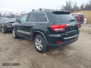 2013 Jeep Grand Cherokee Limited with VIN 1C4RJFBG0DC656382, listed as a IAAI auction lot 41870162 with 162,869 mi miles. Bid and sale history available at carsss.com. Image 3.