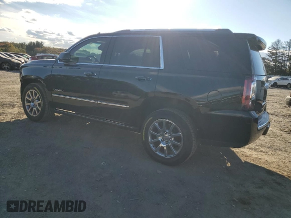 2016 GMC Yukon Denali with VIN 1GKS1CKJXGR329103, listed as a Copart auction lot 75492494 with 124,374 mi miles and Salvage Title. Bid and sale history available at carsss.com. Image 2.