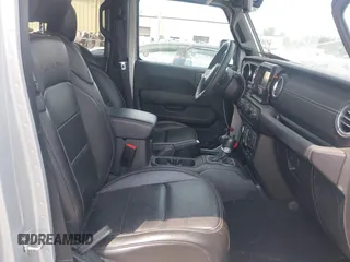 2023 Jeep Wrangler Sahara with VIN 1C4JJXP69PW695915, listed as a IAAI auction lot 42662028 with 36,957 mi miles and . Bid and sale history available at DreamBid. Image 5.