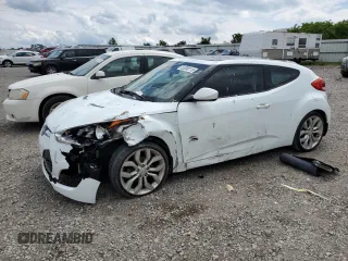 2012 Hyundai Veloster w/Red Int с VIN KMHTC6AD4CU083000, выставлен на аукционе Copart как лот 53200115 с пробегом 123 074 миль миль и Списание • Salvage title. История ставок и продаж доступна на DreamBid. Изображение 1.