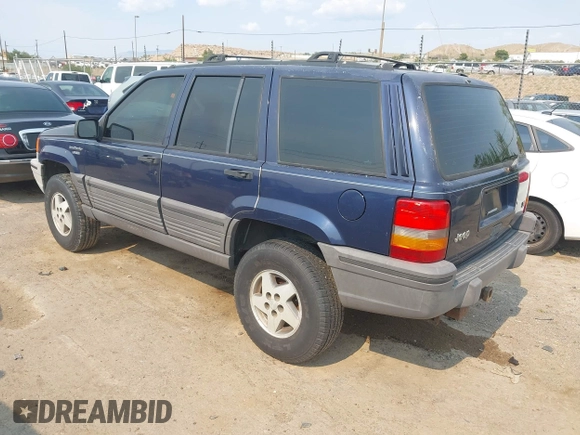 1994 Jeep Grand Cherokee Laredo z VIN 1J4GZ58Y7RC233746, wystawiony jako IAAI lot #42722206 z przebiegiem 196 875 mil mil oraz . Historia ofert i sprzedaży dostępna na DreamBid. Obrazek 3.