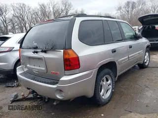 2005 GMC Envoy SLE with VIN 1GKDT13S552332088, listed as a IAAI auction lot 41699178 with 196,869 mi miles. Bid and sale history available at carsss.com. Image 4.