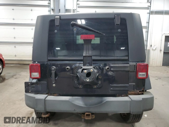 2009 Jeep Wrangler Rubicon with VIN 1J4GA64159L770895, listed as a Copart auction lot 82140864 with 209,464 mi miles and Salvage Title. Bid and sale history available at DreamBid. Image 6.