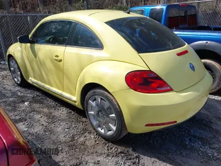 2012 Volkswagen Beetle 2.5L PZEV with VIN 3VWJP7AT4CM603419, listed as a IAAI auction lot 41736444 with 111,647 mi miles. Bid and sale history available at carsss.com. Image 3.