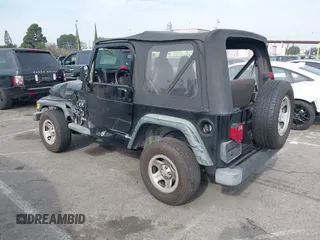 2002 Jeep Wrangler X with VIN 1J4FA39S92P774054, listed as a IAAI auction lot 41470351 with 209,727 mi miles. Bid and sale history available at carsss.com. Image 3.