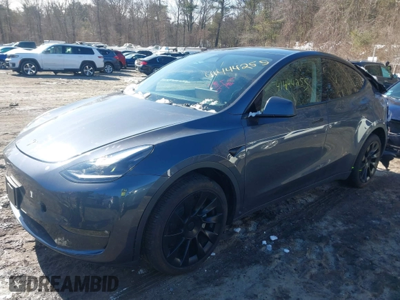 2023 Tesla Model Y Long Range with VIN 7SAYGAEE9PF905943, listed as a IAAI auction lot 41444255 with 11,179 mi miles and . Bid and sale history available at DreamBid. Image 2.
