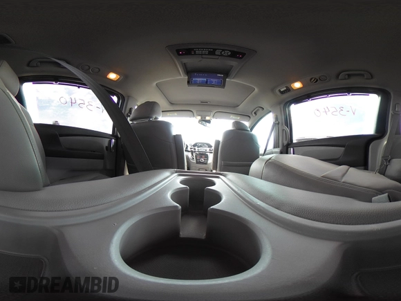 2014 Honda Odyssey Touring with VIN 5FNRL5H91EB093540, listed as a IAAI auction lot 41887412 with 202,076 mi miles and . Bid and sale history available at DreamBid. Image 23.