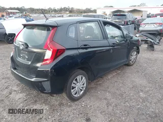 2017 Honda Fit LX with VIN JHMGK5H53HS006718, listed as a IAAI auction lot 41482503 with 77,164 mi miles. Bid and sale history available at carsss.com. Image 4.