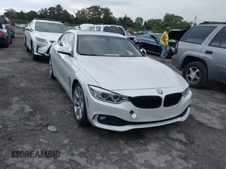 2015 BMW 4 Series 428i with VIN WBA3N3C54FK233803, listed as a IAAI auction lot 40481486 with 74,556 mi miles and . Bid and sale history available at carsss.com. Image 1.