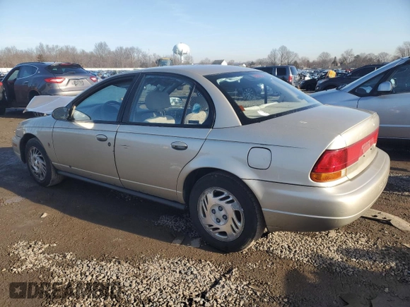 1999 Saturn SL z VIN 1G8ZK5270XZ212874, wystawiony jako Copart lot #85317464 z przebiegiem 153 477 mil mil oraz Szkoda całkowita • Salvage title. Historia ofert i sprzedaży dostępna na DreamBid. Obrazek 2.