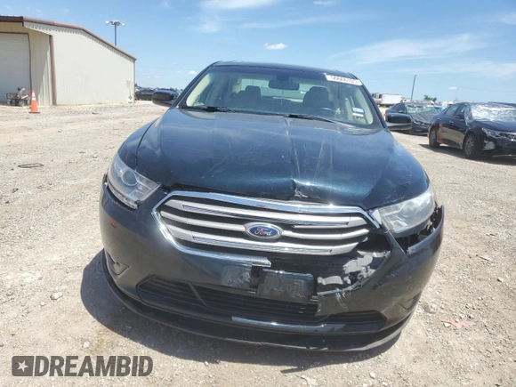 2014 Ford Taurus SEL z VIN 1FAHP2E81EG127398, wystawiony jako Copart lot #56666105 z przebiegiem 96 693 mil mil oraz Szkoda całkowita • Salvage title. Historia ofert i sprzedaży dostępna na DreamBid. Obrazek 5.
