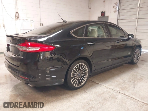 2017 Ford Fusion Titanium with VIN 3FA6P0SUXHR208653, listed as a IAAI auction lot 41312067 with 62,601 mi miles and . Bid and sale history available at DreamBid. Image 4.