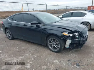 2017 Ford Fusion SE z VIN 3FA6P0HDXHR335281, wystawiony jako IAAI lot #41541745 z przebiegiem 144 035 mil mil oraz . Historia ofert i sprzedaży dostępna na DreamBid. Obrazek 1.