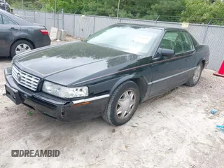 2002 Cadillac Eldorado ESC z VIN 1G6EL12Y82B105241, wystawiony jako IAAI lot #42241609 z przebiegiem 90 442 mil mil oraz . Historia ofert i sprzedaży dostępna na DreamBid. Obrazek 2.