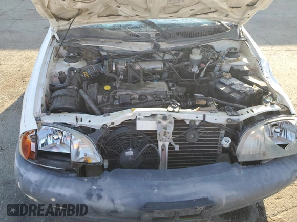 1999 Suzuki Swift z VIN 2S2AB21H7X6601864, wystawiony jako Copart lot #72661164 z przebiegiem 261 948 mil mil oraz Szkoda całkowita • Salvage title. Historia ofert i sprzedaży dostępna na DreamBid. Obrazek 11.