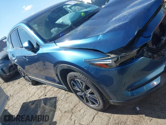 2017 Mazda CX-5 Grand Touring with VIN JM3KFADL8H0105518, listed as a IAAI auction lot 41876779 with 82,540 mi miles. Bid and sale history available at carsss.com. Image 1.
