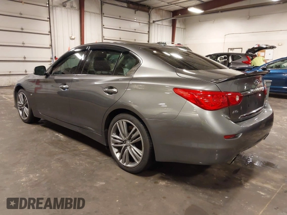 2014 Infiniti Q50 Premium with VIN JN1BV7ARXEM699902, listed as a IAAI auction lot 42135410 with 103,929 mi miles and . Bid and sale history available at DreamBid. Image 3.