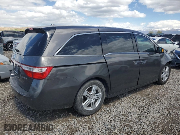 2012 Honda Odyssey Touring with VIN 5FNRL5H97CB070213, listed as a Copart auction lot 53558715 with 218,964 mi miles and Salvage title. Bid and sale history available at DreamBid. Image 3.