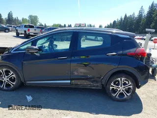 2018 Chevrolet Bolt EV Premier z VIN 1G1FX6S03J4130637, wystawiony jako IAAI lot #42185946 z przebiegiem 39 014 mil mil oraz . Historia ofert i sprzedaży dostępna na DreamBid. Obrazek 15.