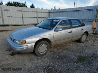 1993 Ford Taurus GL with VIN 1FALP52U6PG231014, listed as a Copart auction lot 69260814 with 156,668 mi miles and Salvage Title. Bid and sale history available at carsss.com. Image 1.