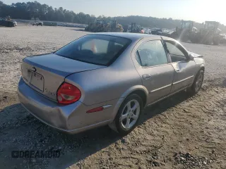2001 Nissan Maxima GXE z VIN JN1CA31D11T828767, wystawiony jako Copart lot #69504024 z przebiegiem 177 431 mil mil oraz Szkoda całkowita • Salvage title. Historia ofert i sprzedaży dostępna na DreamBid. Obrazek 3.