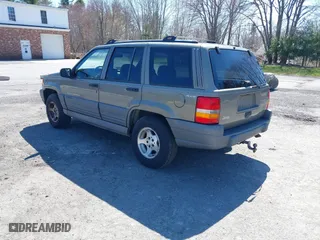 1997 Jeep Grand Cherokee Laredo with VIN 1J4GZ58S7VC713517, listed as a IAAI auction lot 42062214 with 205,533 mi miles. Bid and sale history available at carsss.com. Image 3.